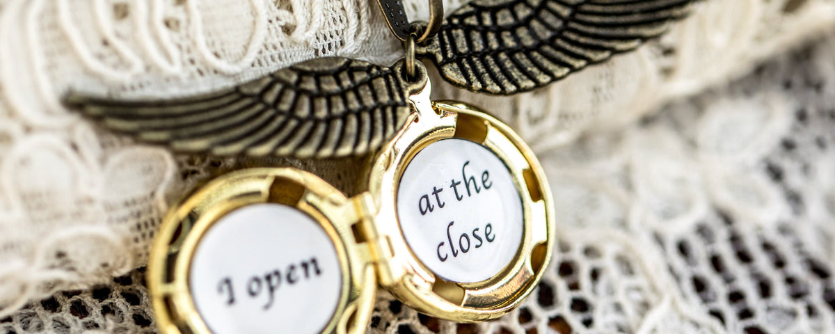 I open at the close golden snitch necklace