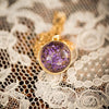 purple dried flower orb silver necklace on lace background