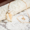 Real Conch Shell Necklace on lace background