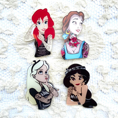Four punk princesses with tattoos on pins on lace backdrop 