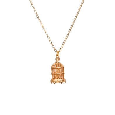 Birdcage pendant necklace in gold on white background