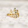 adjustable wrap leaf ring on white background lace