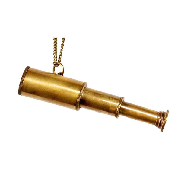 Small brass three tiered working spyglass on a gold chain on white background