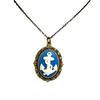 White resin anchor on a navy blue background in a brass filigree cabachon setting on a white background
