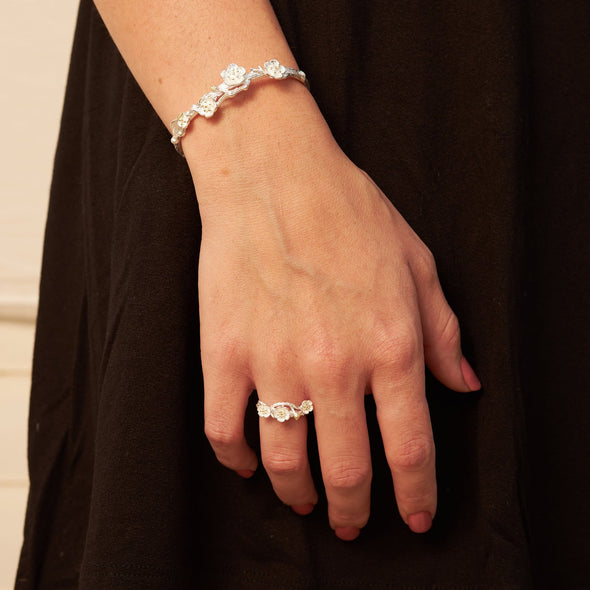 plum blossom ring and bracelet on model