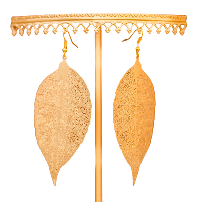real laser cut gold earings on whote backdrop